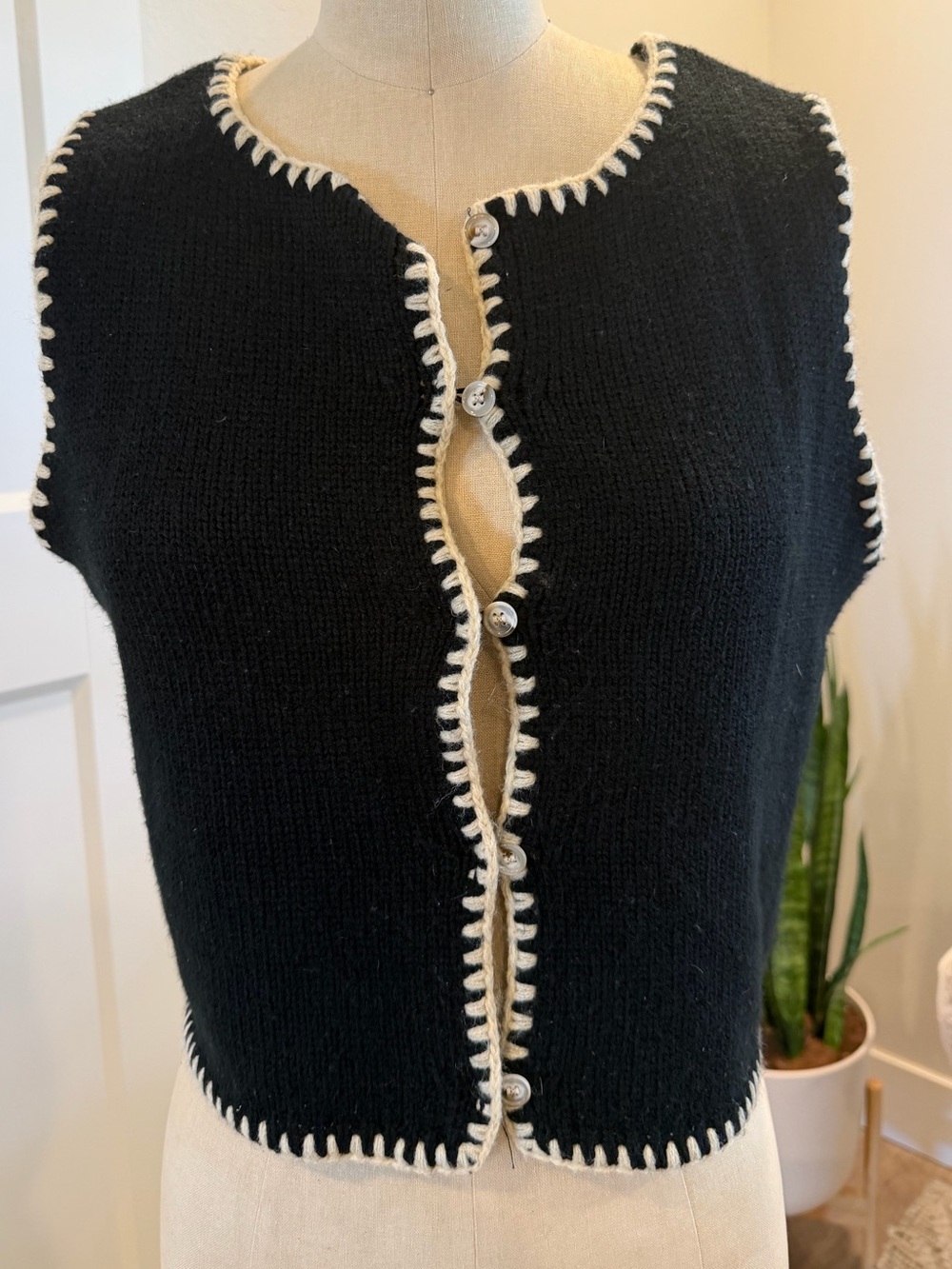 Black Sleeveless Knit Button-Up Vest with Cream Whipstitch Trim
